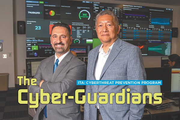 In the City’s Integrated Security Operations Center are (from left) Ted Ross, General Manager and Chief Information Officer, 23 years; and Tim Lee, Chief Security Information Officer, 29 years of City service. Both are Club Members.